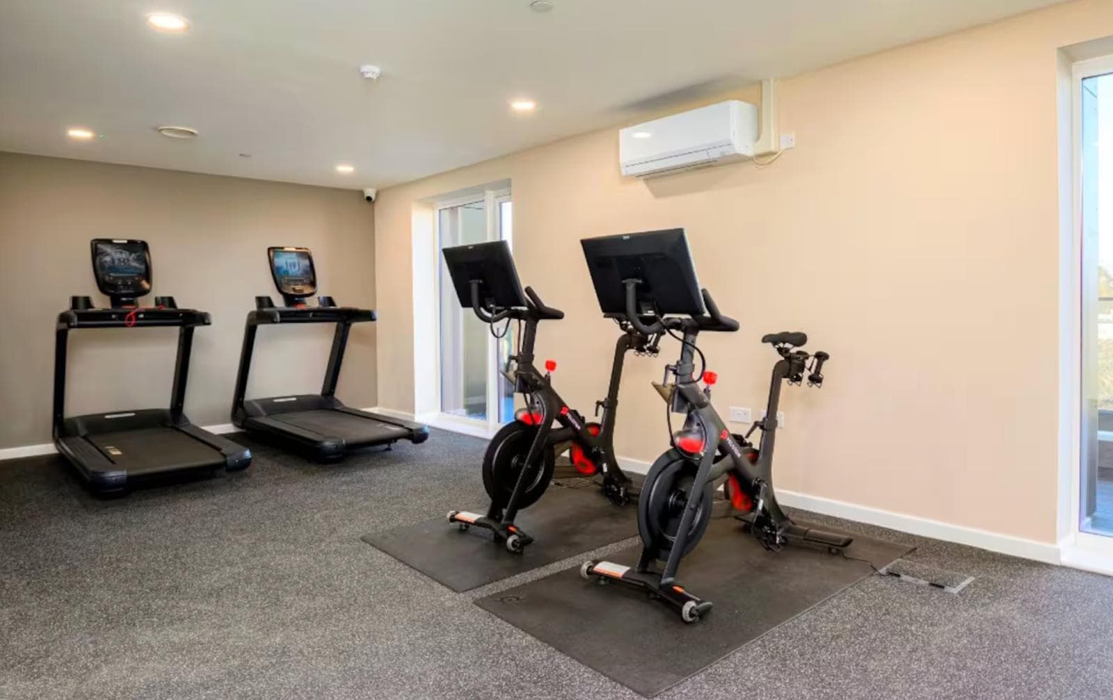 Bright on-site gym with treadmills and bikes for easy vacation workouts